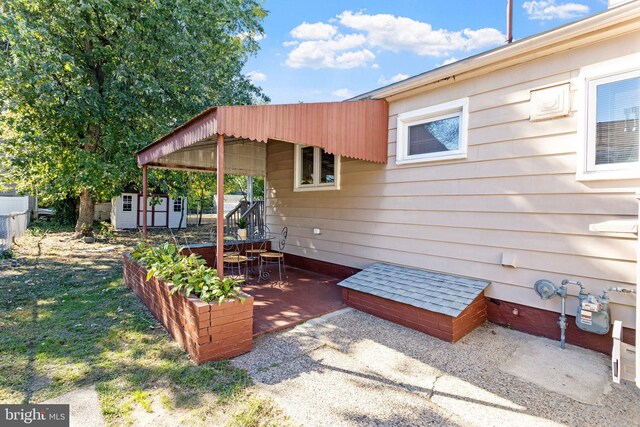 view of patio / terrace featuring a storage shed