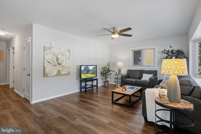 living room with dark hardwood / wood-style floors and ceiling fan