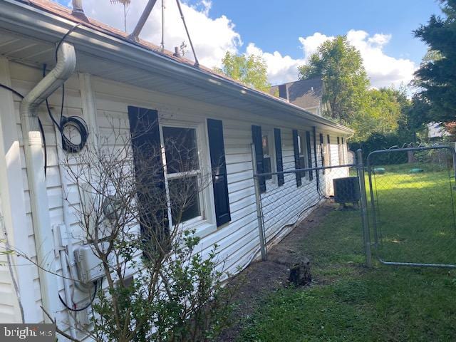 view of property exterior featuring a lawn