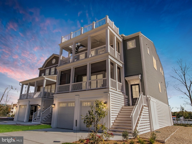 view of front of home featuring a balcony and a garage