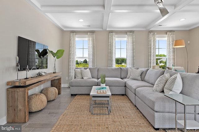 living room with coffered ceiling, beamed ceiling, and hardwood / wood-style floors