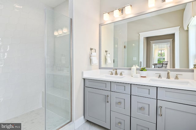 bathroom featuring vanity and tiled shower