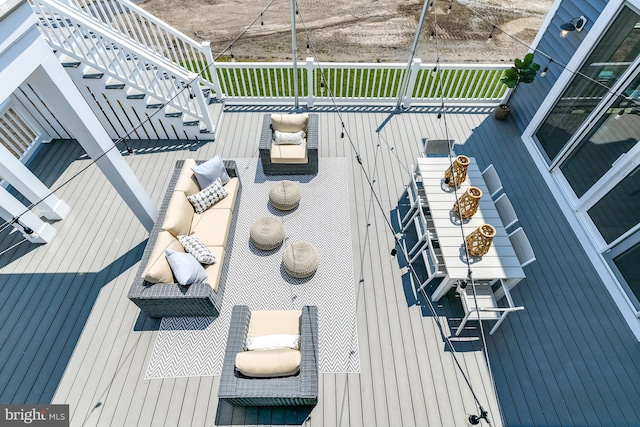 wooden deck featuring an outdoor hangout area