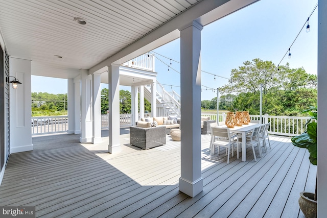 wooden deck featuring outdoor lounge area