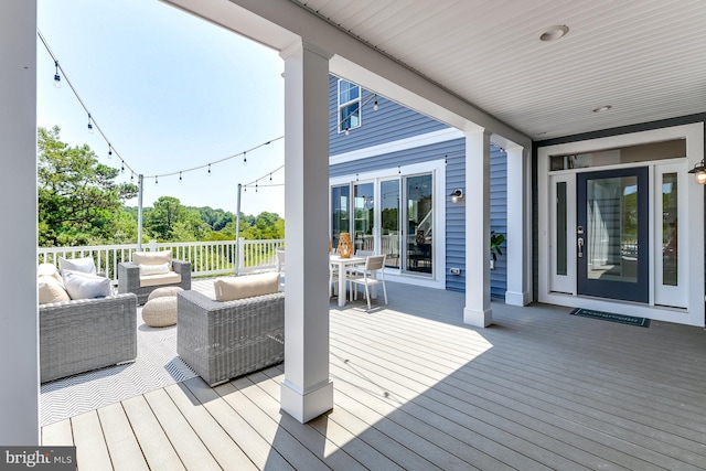 wooden terrace featuring outdoor lounge area