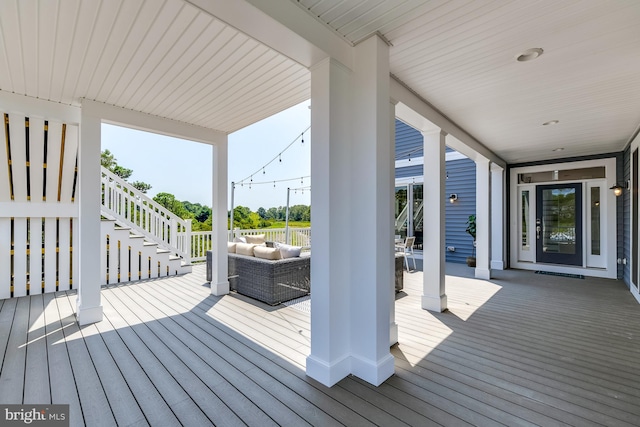 wooden deck featuring outdoor lounge area