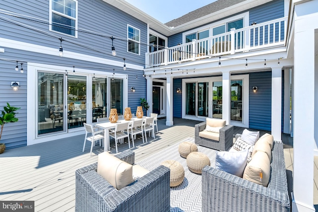 wooden terrace featuring outdoor lounge area