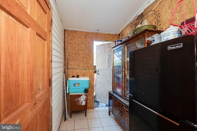 bathroom featuring crown molding and tile patterned floors