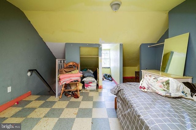 bedroom featuring vaulted ceiling