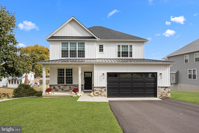 modern farmhouse style home featuring a garage and a front lawn