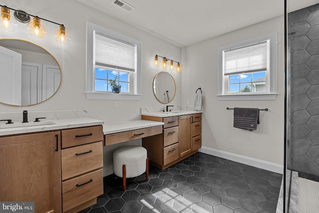 bathroom with vanity and tile patterned flooring