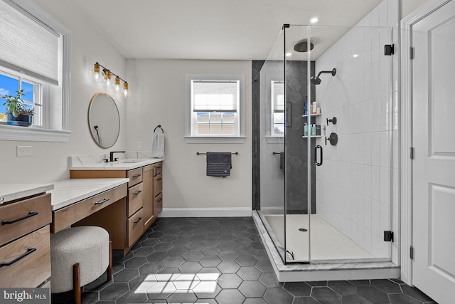 bathroom with vanity, tile patterned flooring, and a shower with door