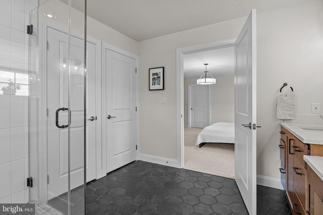 bathroom with vanity and a shower with shower door