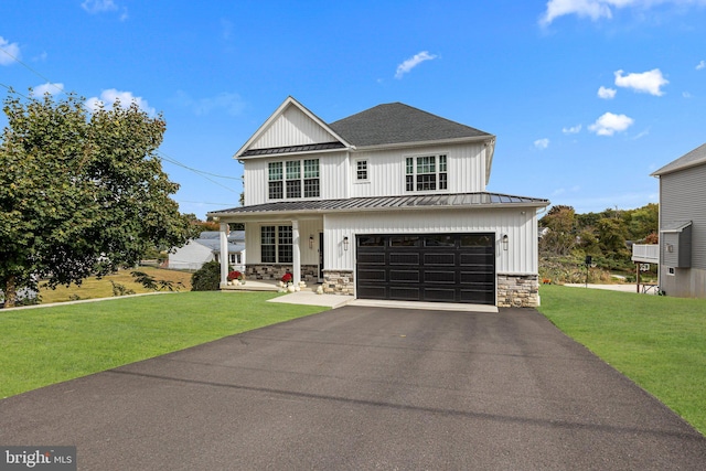 view of front facade featuring a garage and a front lawn