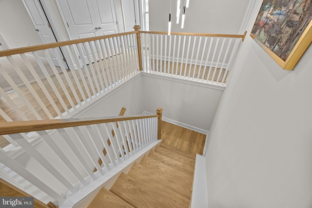 stairway featuring hardwood / wood-style floors