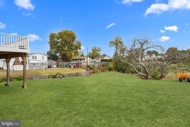 view of yard with a wooden deck