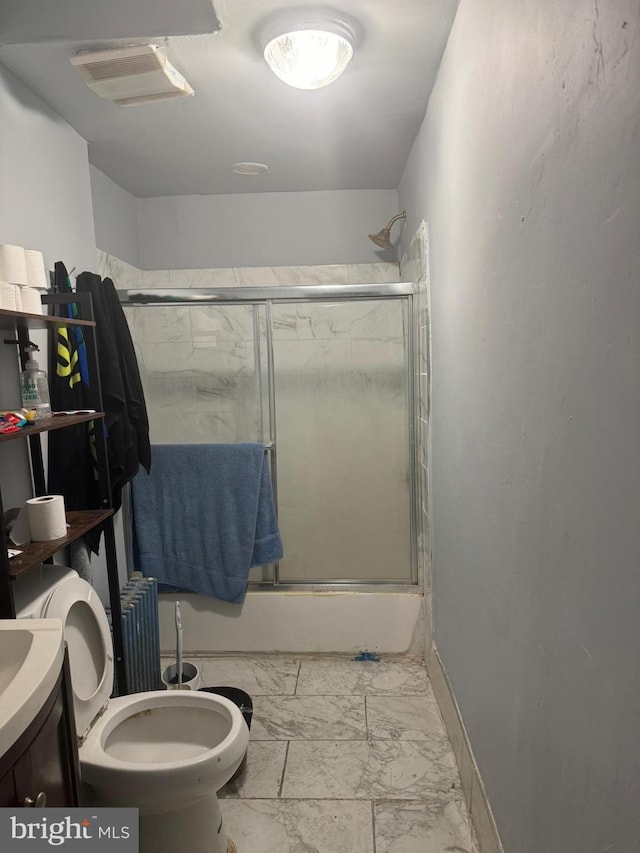 full bathroom featuring vanity, toilet, enclosed tub / shower combo, and radiator heating unit