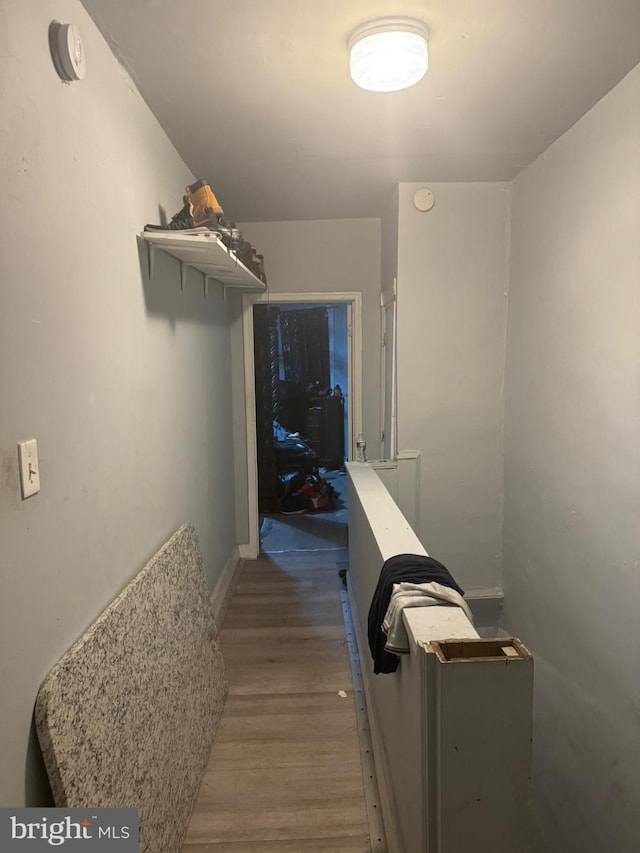 hallway featuring hardwood / wood-style flooring