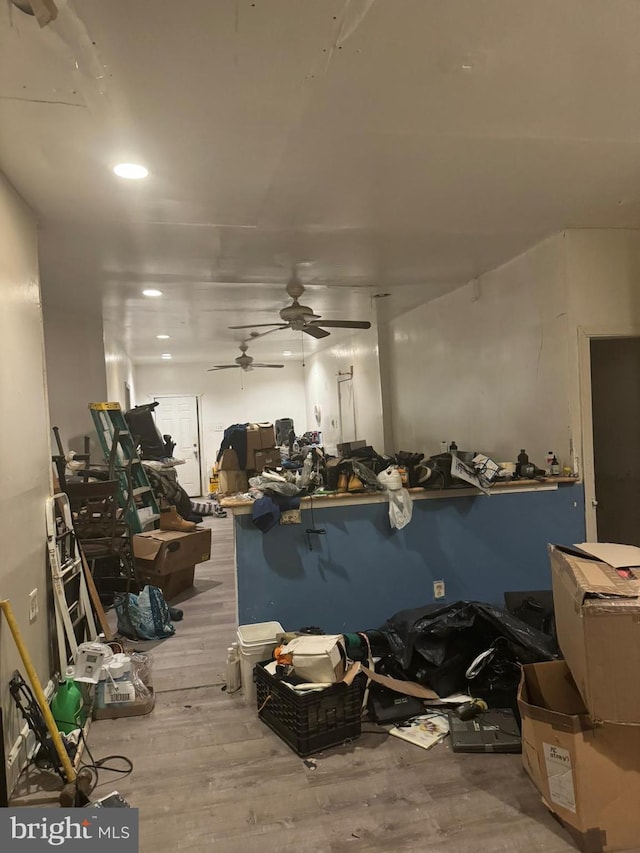 misc room featuring ceiling fan and light hardwood / wood-style flooring