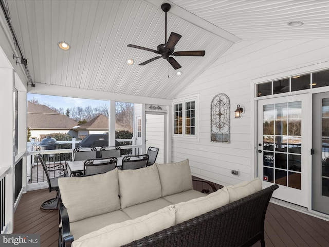 sunroom with wood ceiling, ceiling fan, and vaulted ceiling