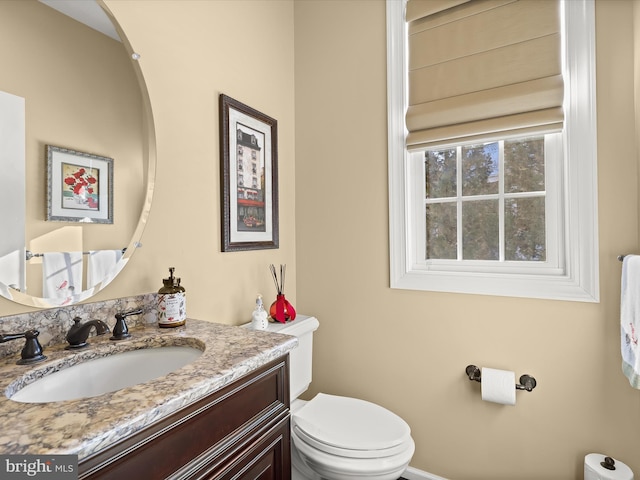 bathroom with vanity and toilet