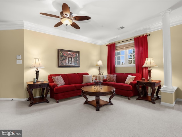 carpeted living room featuring crown molding, ceiling fan, and ornate columns