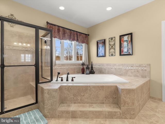 bathroom featuring separate shower and tub and tile patterned floors