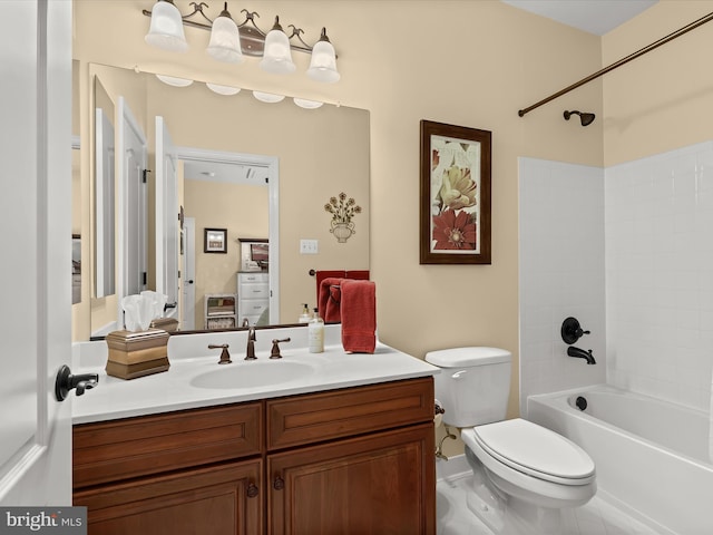 full bathroom with vanity, tiled shower / bath combo, and toilet