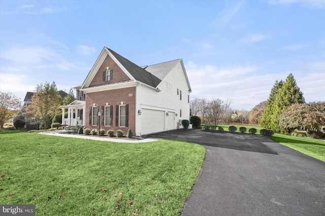 view of home's exterior featuring a garage and a yard