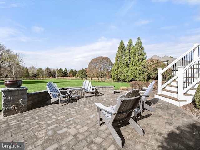 view of patio / terrace with an outdoor fire pit