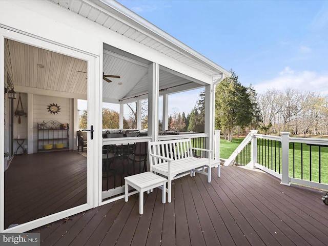 wooden terrace with a yard