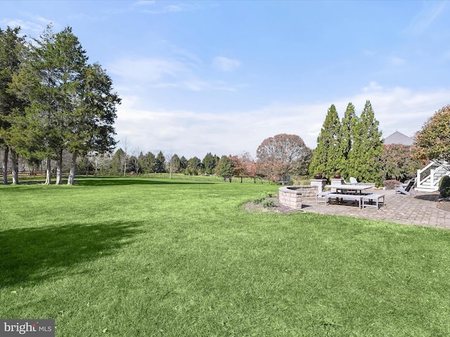 view of yard featuring a patio area and a rural view