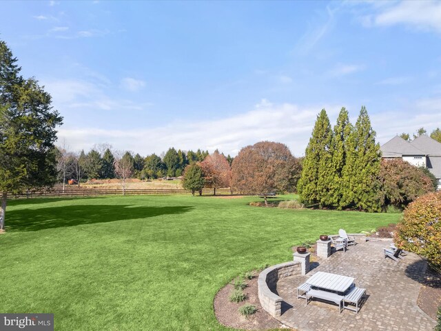 view of yard with a patio area and a rural view