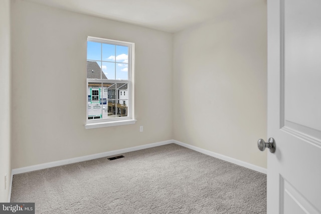 empty room with carpet flooring