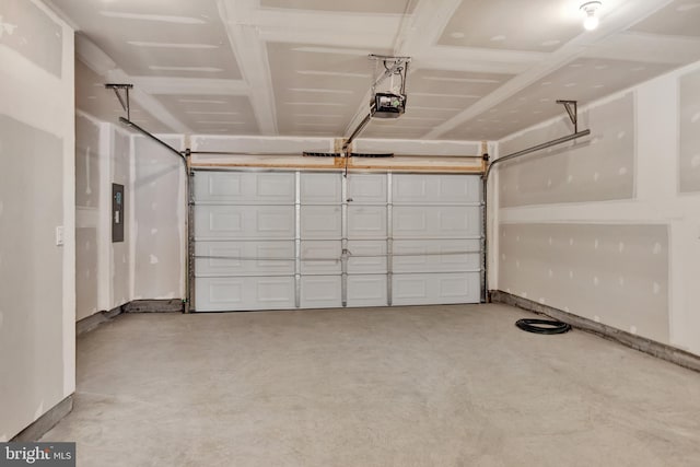 garage featuring a garage door opener and electric panel