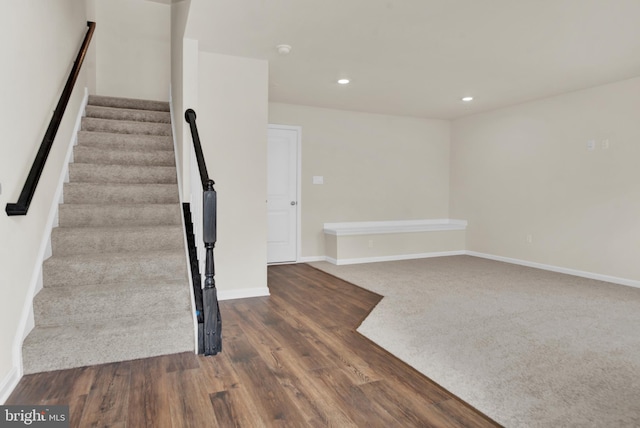 staircase featuring hardwood / wood-style floors