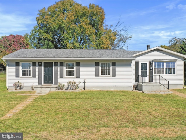 ranch-style home with a front lawn