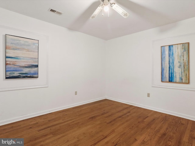 empty room featuring hardwood / wood-style floors and ceiling fan