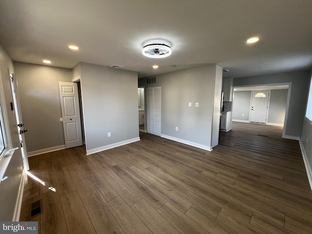 empty room featuring dark wood-type flooring