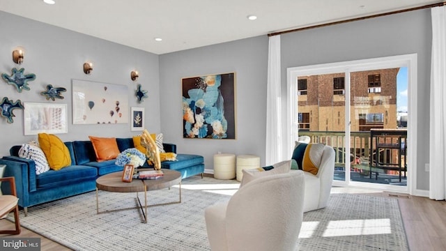 living room featuring light hardwood / wood-style flooring and a wealth of natural light