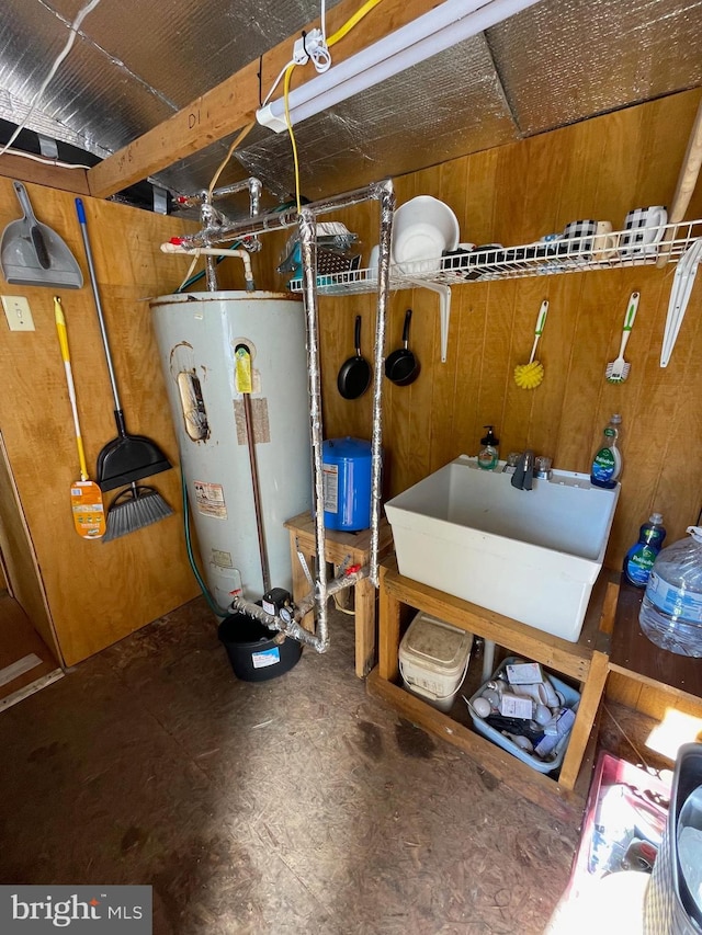 utility room featuring water heater and sink