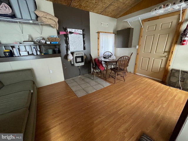 kitchen featuring hardwood / wood-style flooring and heating unit