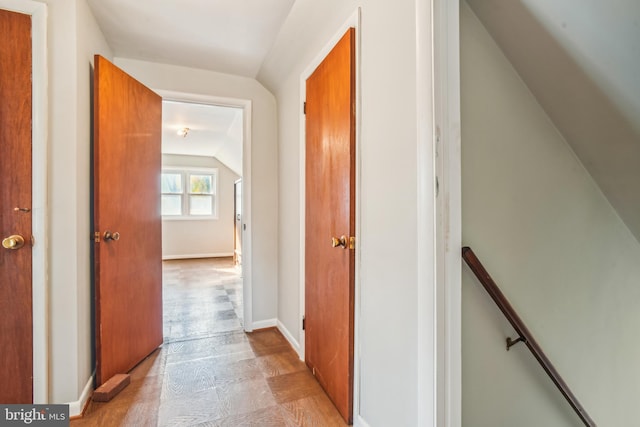 corridor with lofted ceiling