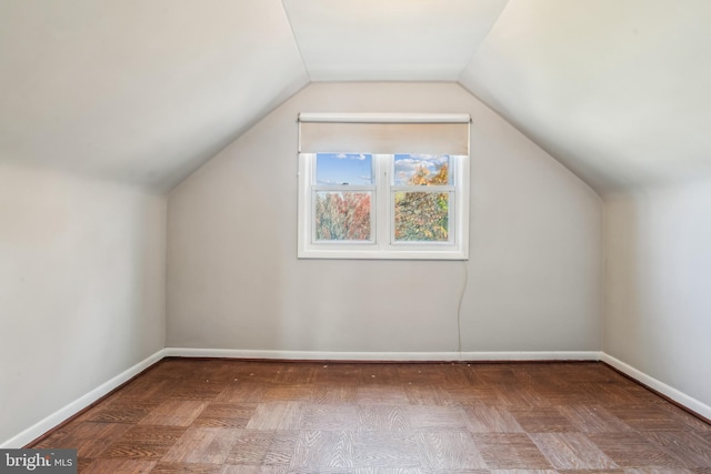 additional living space with parquet floors and lofted ceiling