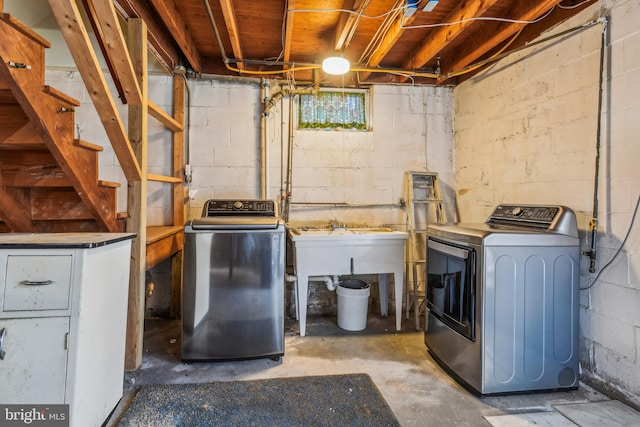 laundry area featuring separate washer and dryer and sink