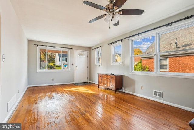 interior space featuring plenty of natural light, ceiling fan, and light hardwood / wood-style floors