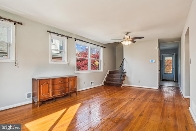 interior space featuring a wealth of natural light, hardwood / wood-style floors, and ceiling fan