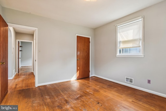 unfurnished bedroom with wood-type flooring