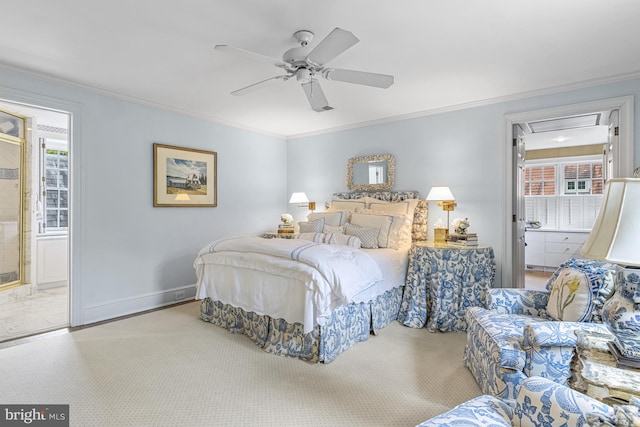 bedroom featuring ceiling fan, crown molding, multiple windows, and ensuite bath