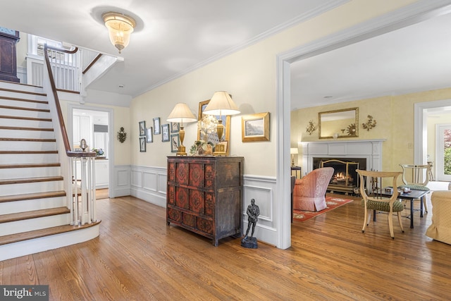 entryway featuring crown molding and wood-type flooring